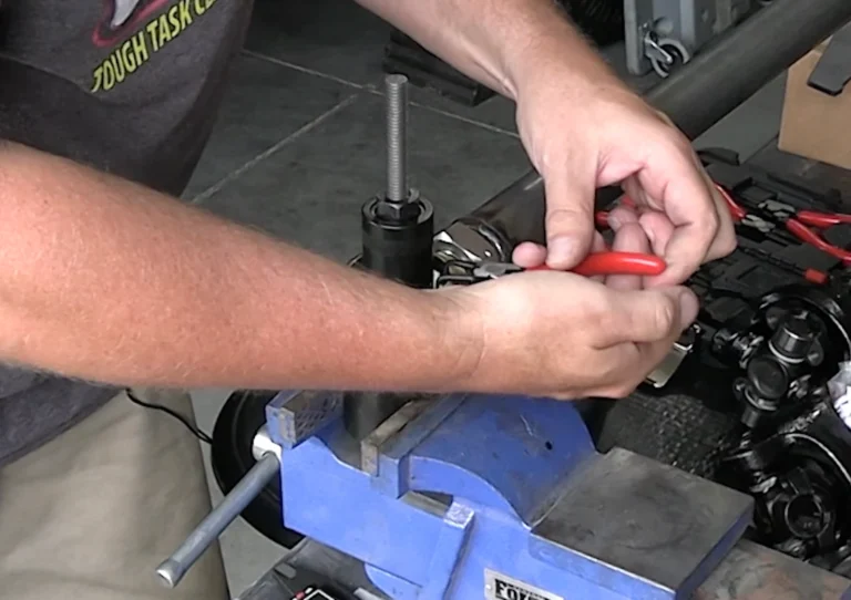 3Remove the Snap Ring  SYZ Rod Ends Remove the Snap Ring
